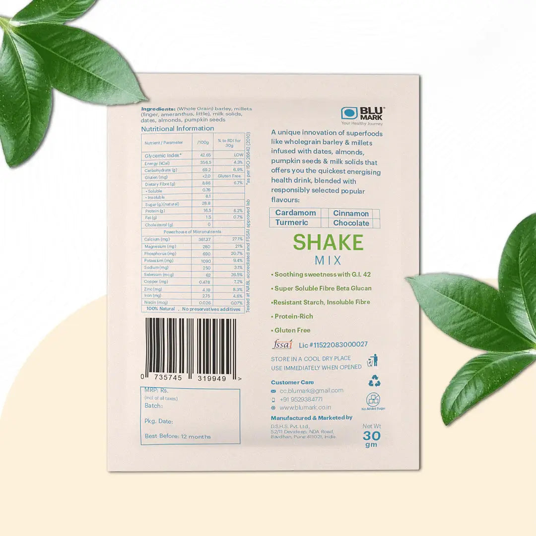 Shake mix package with nutritional information and branding on a beige background with green leaves.