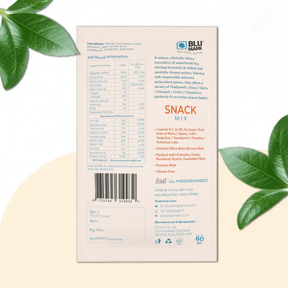 Back of a snack mix package with nutritional information and branding on a beige background with green leaves.